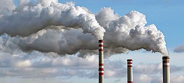 detail of white smoke polluted sky